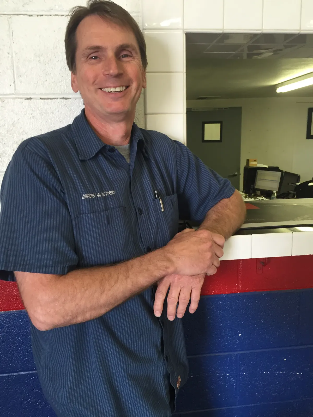 Import Auto Pros team member at the service counter
